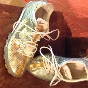 Metallic gold tennis shoes
